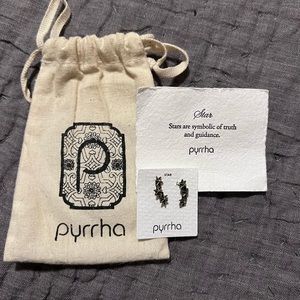 Phyrrha star crawler earrings.